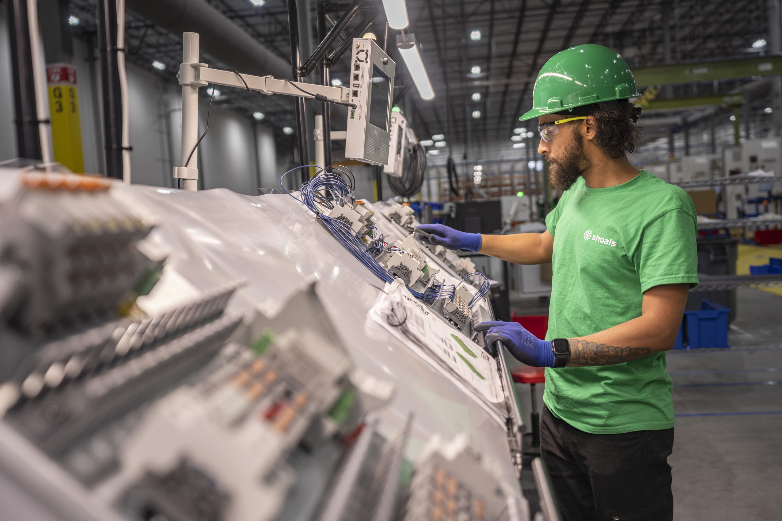 Shoals team member at work in the BESS section of the new facility